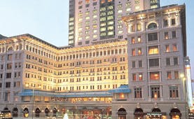 The Peninsula Hong Kong exterior shot large white hotel with awnings