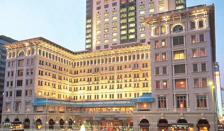 The Peninsula Hong Kong exterior shot large white hotel with awnings