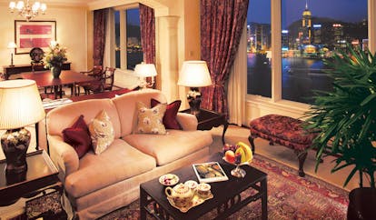 The Peninsula Hong Kong grand deluxe suite lounge sofa ottoman tea service dining area city view
