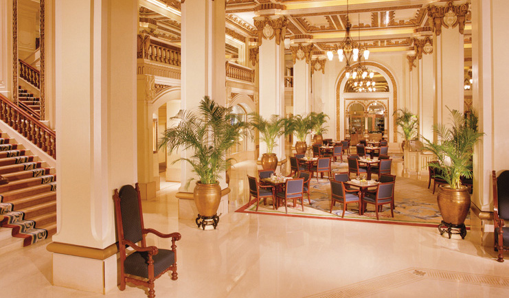 The Peninsula Hong Kong lobby seating area opulent decor large vases with plants