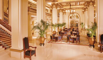 The Peninsula Hong Kong lobby seating area opulent decor large vases with plants