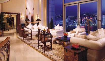 The Peninsula Hong Kong lounge seating area sofas armchairs telescope panoramic city and harbour view
