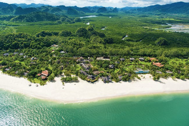 Four Seasons Langkawi Malaysia beach and resort aerial shot white sand hotel buildings rainforest