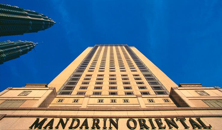Mandarin Oriental Kuala Lumpur exterior hotel building sign vertical view from the ground