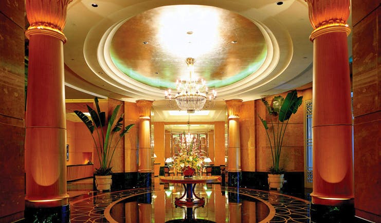 Mandarin Oriental Kuala Lumpur lobby ornate décor chandelier columns marble