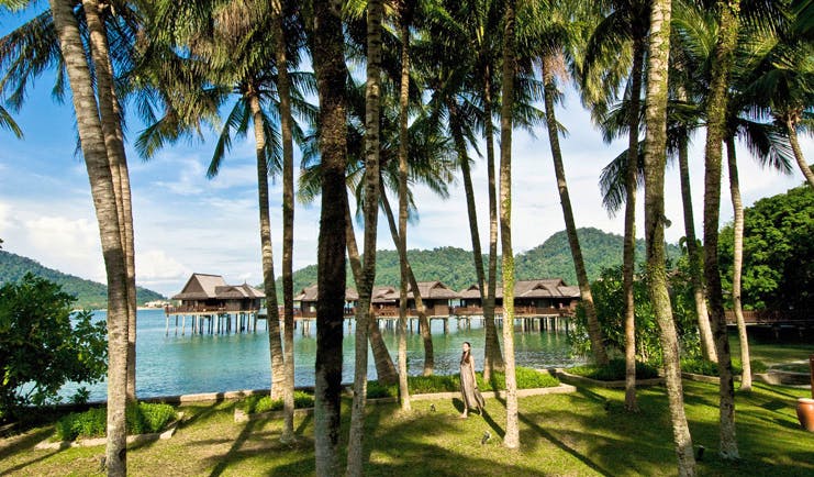 Pangkor Laut Malaysia sea villas on stilts gardens trees rainforest in background