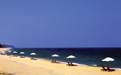 Tanjong Jara Malaysia beach sand sea sun loungers umbrellas