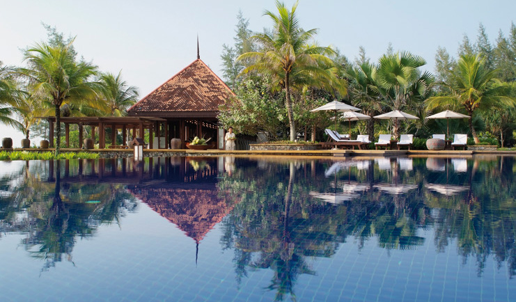 Tanjong Jara Malaysia infinity pool sun loungers umbrellas trees