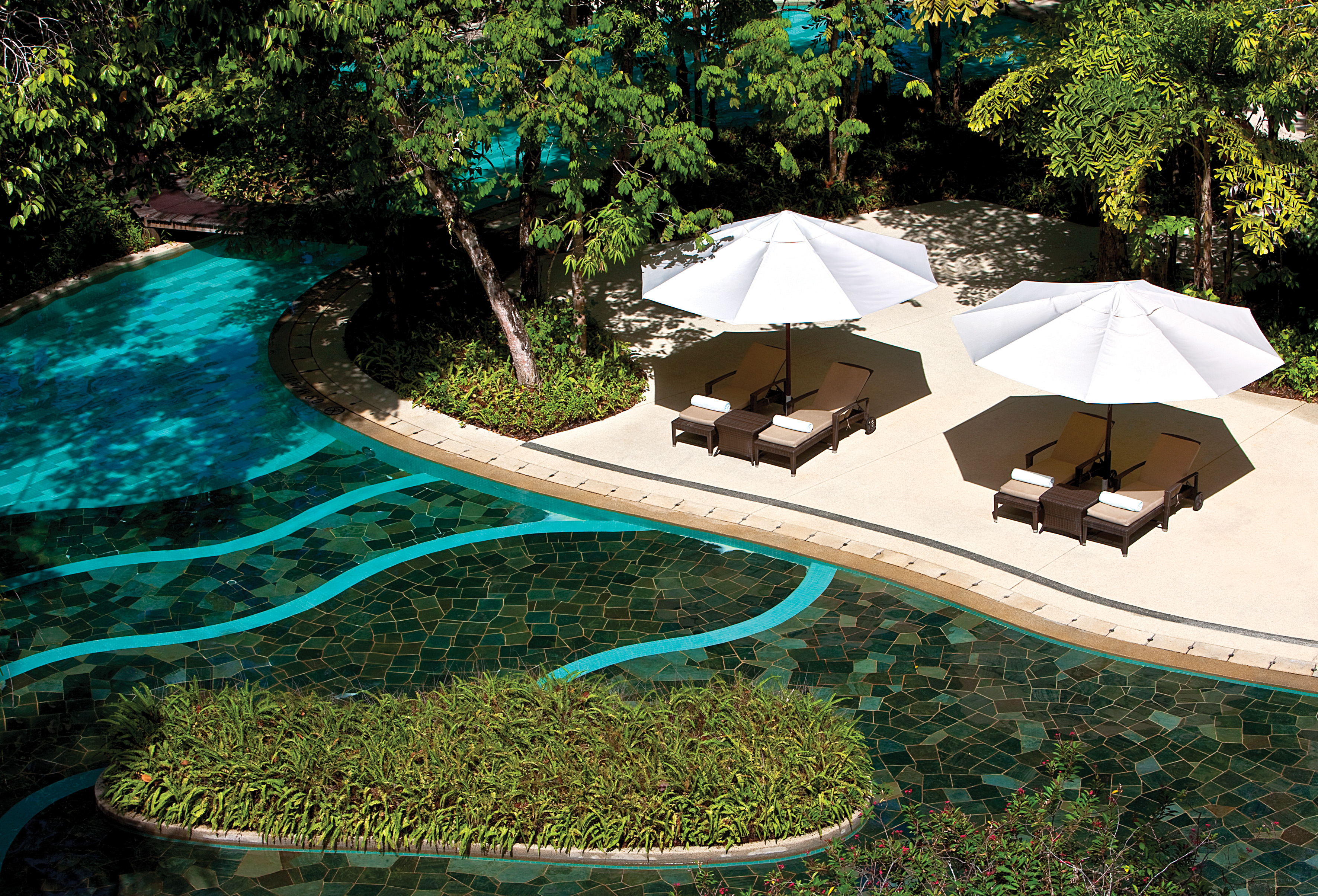 The Andaman Langkawi Malaysia pool terrace sun loungers umbrellas