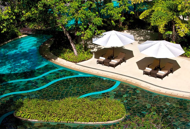 The Andaman Langkawi Malaysia pool terrace sun loungers umbrellas