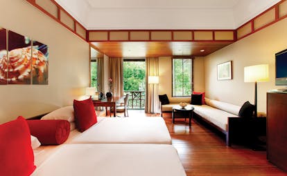 The Andaman Langkawi Malaysia rainforest guestroom twin beds sofa modern décor rainforest views
