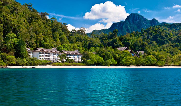 The Andaman Langkawi Malaysia hotel exterior view from the sea rainforest in background