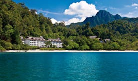 The Andaman Langkawi Malaysia hotel exterior view from the sea rainforest in background