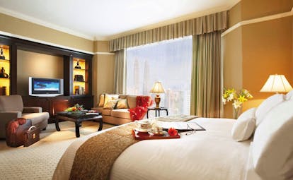 Ritz Carlton Kuala Lumpur deluxe guestroom bed sofa modern décor