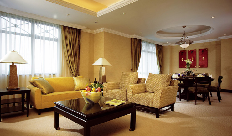 Ritz Carlton Kuala Lumpur suite lounge sofas armchairs modern décor