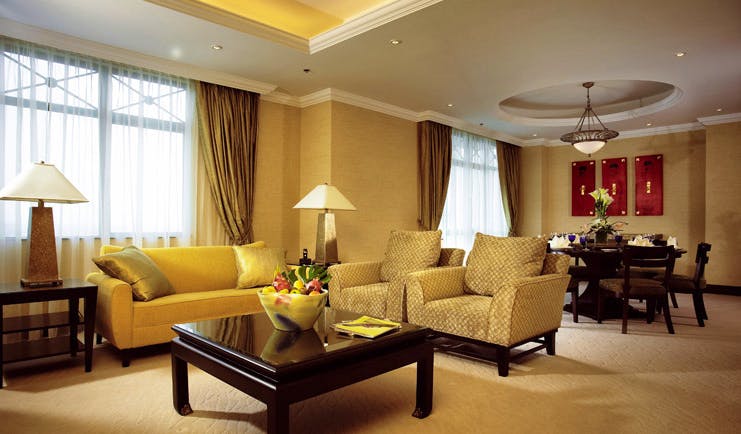 Ritz Carlton Kuala Lumpur suite lounge sofas armchairs modern décor