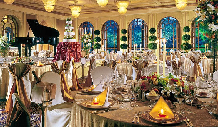 Four Seasons Singapore wedding banquet opulent decor wedding cake floral arrangements grand piano
