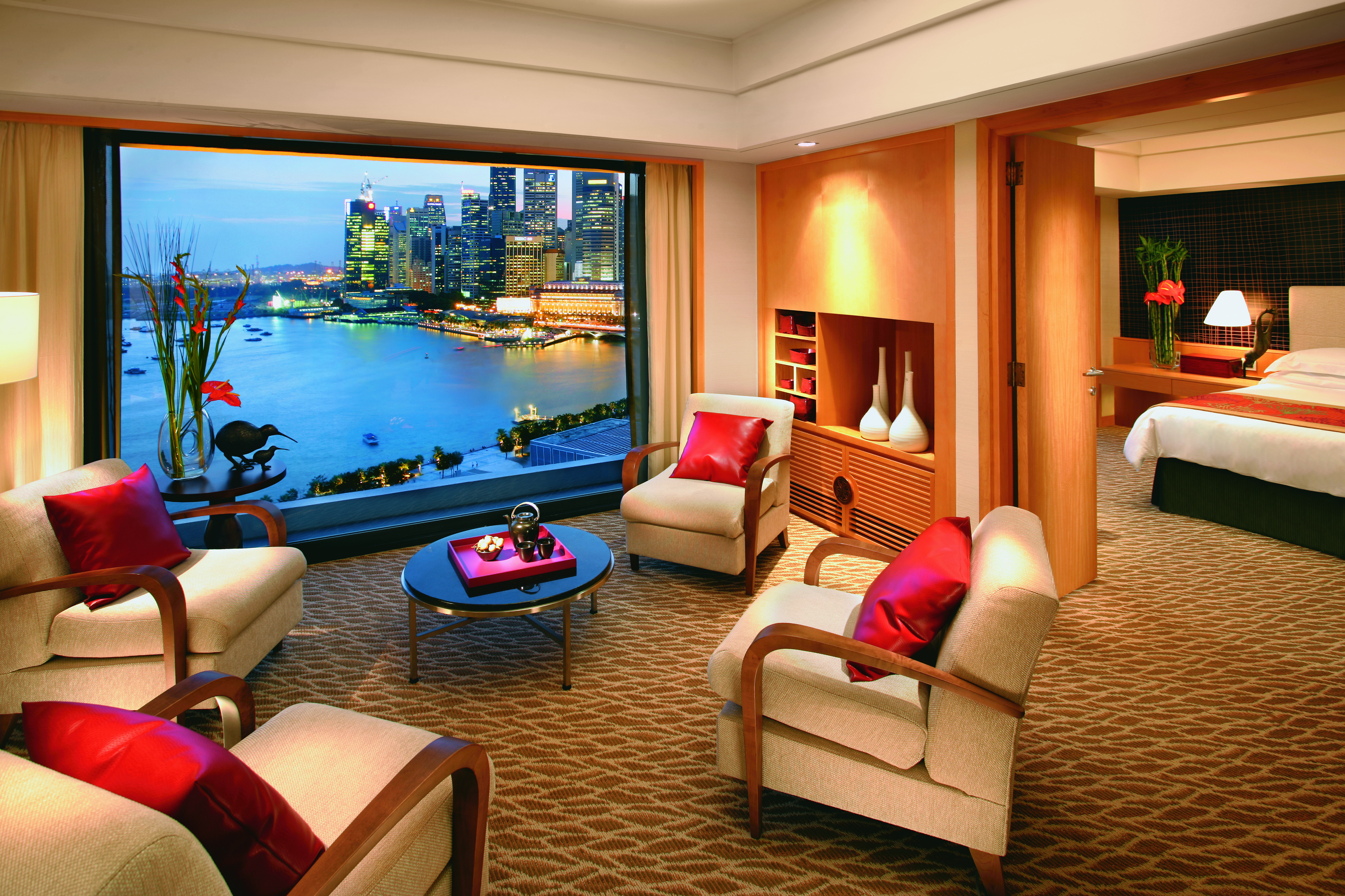 Mandarin Oriental Singapore suite lounge indoor seating area bed window overlooking harbour
