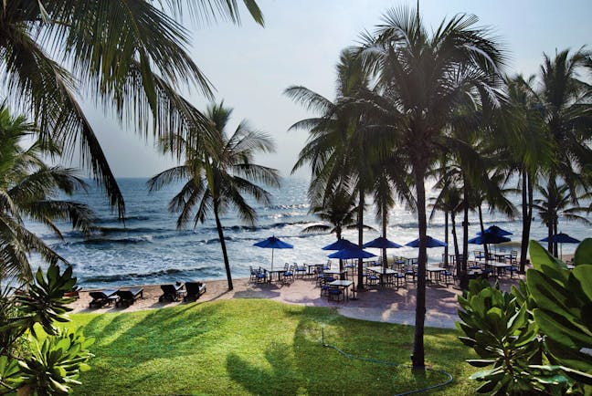 Anantara Hua Hin Thailand beach sun loungers umbrellas outdoor seating palm trees