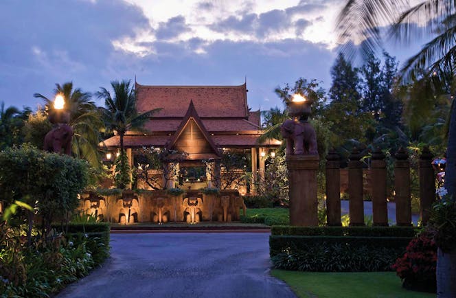 Anantara Hua Hin Thailand entrance at night traditional architecture lawns trees