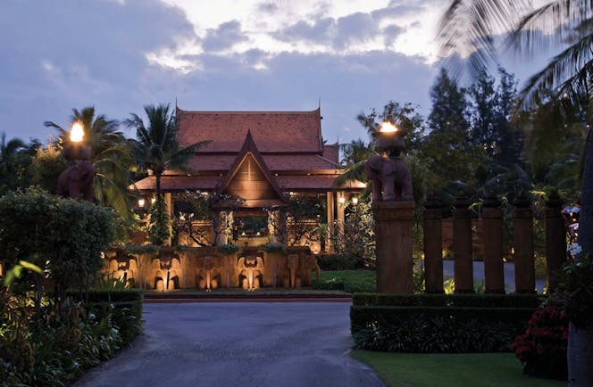 Anantara Hua Hin Thailand entrance at night traditional architecture lawns trees