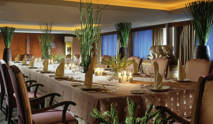 Anantara Siam Bangkok Thailand classic dining room candles elephant sculptures greenery