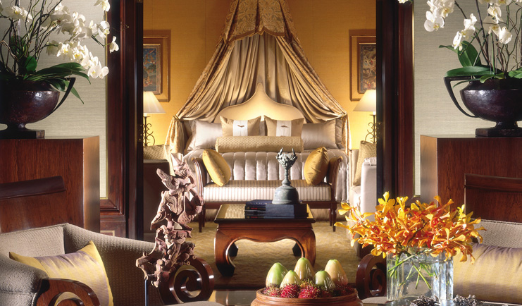 Anantara Siam Bangkok Thailand suite double bed with drapes sitting area opulent decor