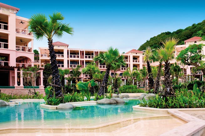 Centara Grand Beach Resort Thailand poolside sun loungers umbrellas ocean in background