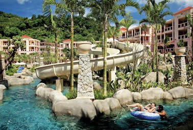 Centara Grand Beach Resort Thailand waterpark slides lazy river girl in dinghy