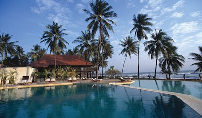 Evason Hua Hin Resort Thailand outdoor swimming pool loungers palm trees ocean view