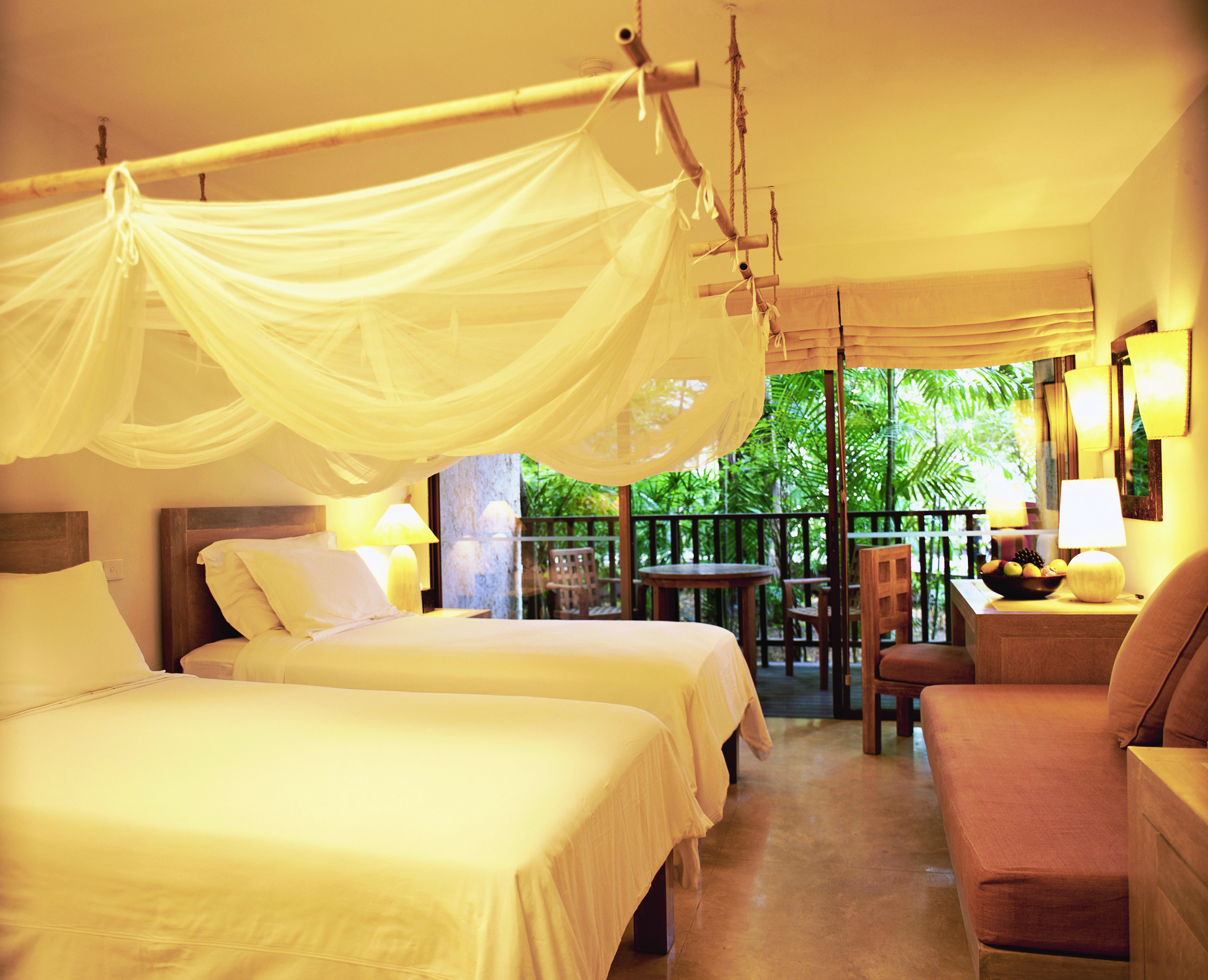 Evason Hua Hin Resort Thailand twin bedroom mosquito drapes sofa balcony
