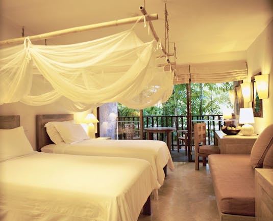Evason Hua Hin Resort Thailand twin bedroom mosquito drapes sofa balcony