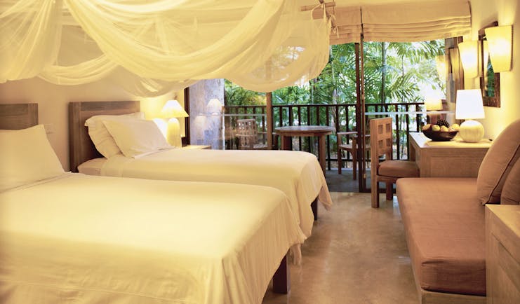 Evason Hua Hin Resort Thailand twin bedroom mosquito drapes sofa balcony