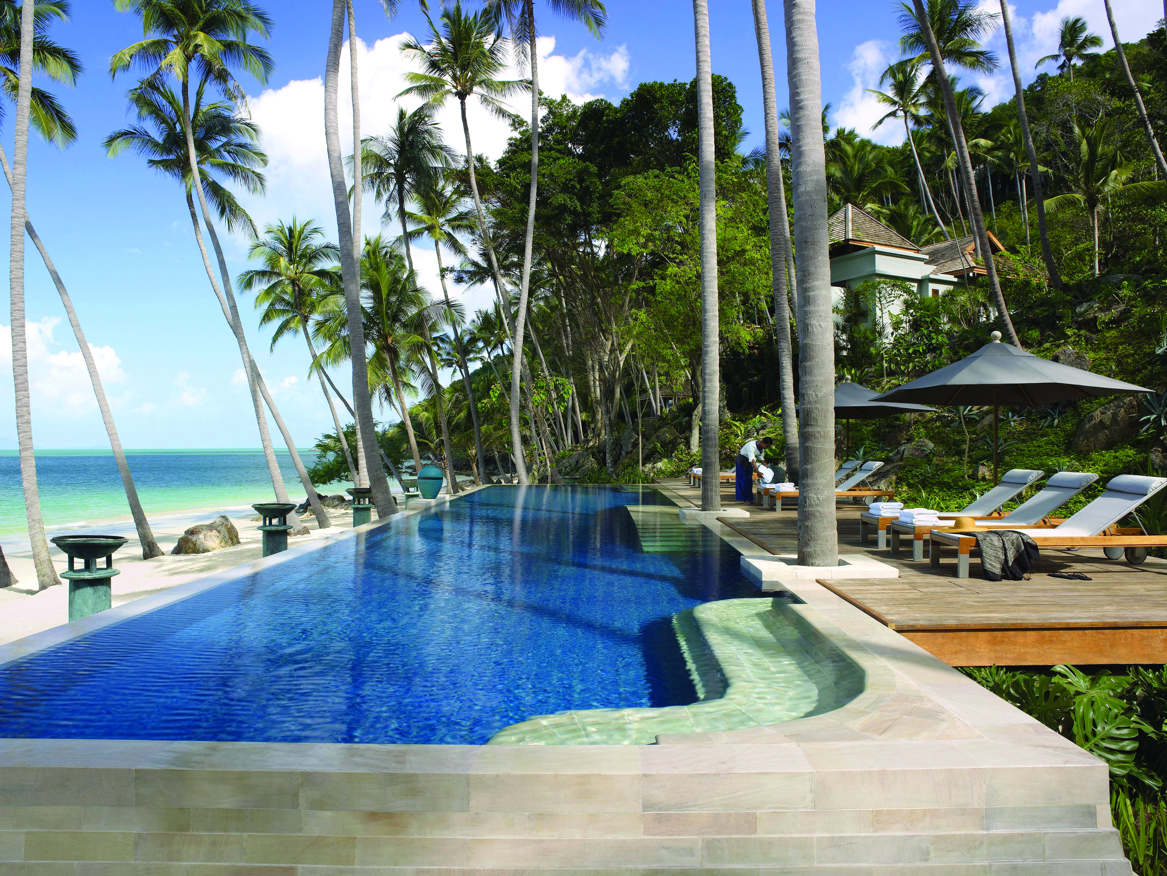 Four Seasons Koh Samui Thailand pool sun loungers umbrellas pool on beach front