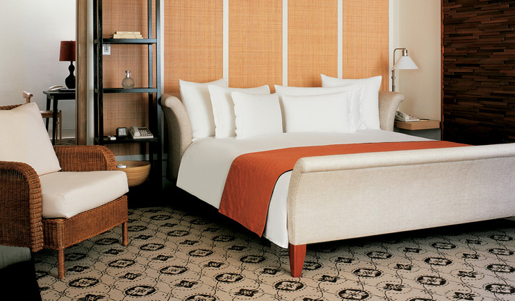 Grand Hyatt Erawan Bangkok Thailand spa cottage bedroom armchair minimalist classic decor