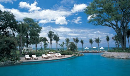 Hyatt Regency Hua Hin Thailand lagoon pool loungers palm trees ocean view