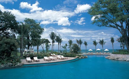 Hyatt Regency Hua Hin Thailand lagoon pool loungers palm trees ocean view