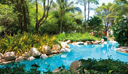Hyatt Regency Hua Hin Thailand river pool gardens palm trees and bridge