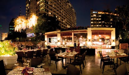 Mandarin Oriental Bangkok Thailand barbeque terrace outdoor dining area at night