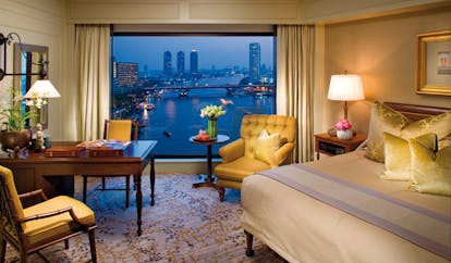 Mandarin Oriental Bangkok Thailand deluxe bedroom sitting area panoramic river city view