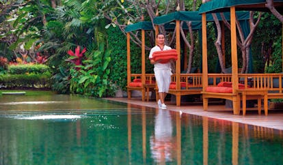 Mandarin Oriental Bangkok Thailand infinity pool gardens cabana staff member