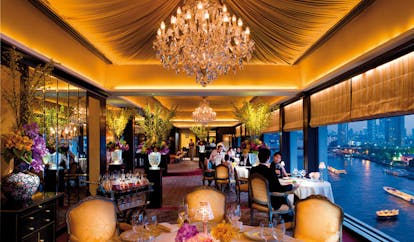 Mandarin Oriental Bangkok Thailand Le Normandie restaurant opulent decor chandelier floral arrangement river view