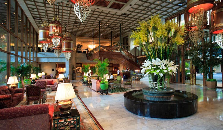 Mandarin Oriental Bangkok Thailand lobby seating area opulent traditional decor flower arrangements