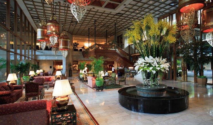 Mandarin Oriental Bangkok Thailand lobby seating area opulent traditional decor flower arrangements