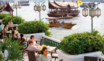 Mandarin Oriental Bangkok Thailand riverside terrace outdoor dining river view boats