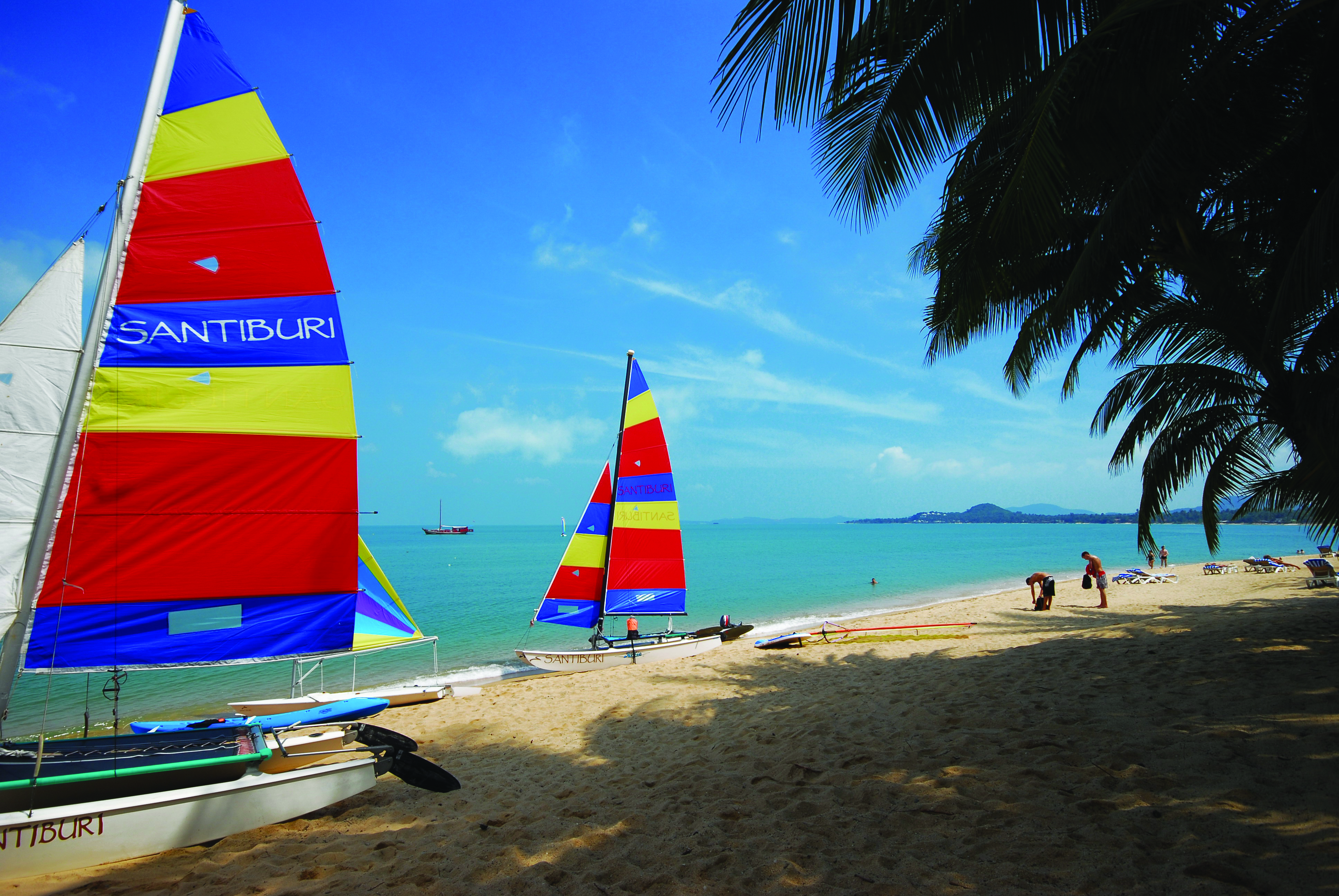 Santiburi Resort Thailand beach sailing boats moored on beach sand sea 