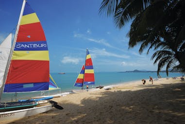 Santiburi Resort Thailand beach sailing boats moored on beach sand sea 