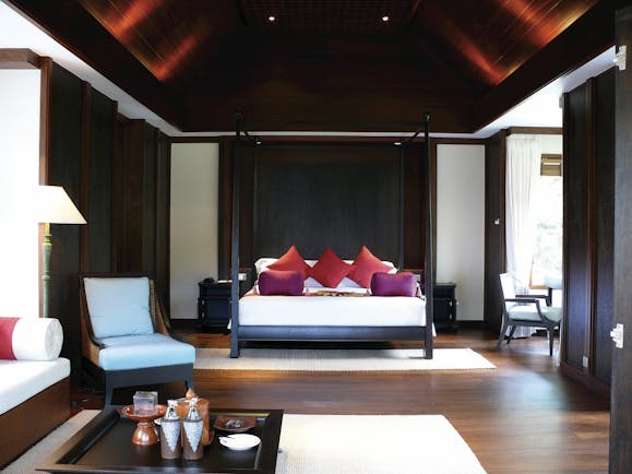Santiburi Resort Thailand villa bedroom four poster bed modern décor armchair