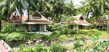 Santiburi Resort Thailand villa exteriors gardens lawns trees