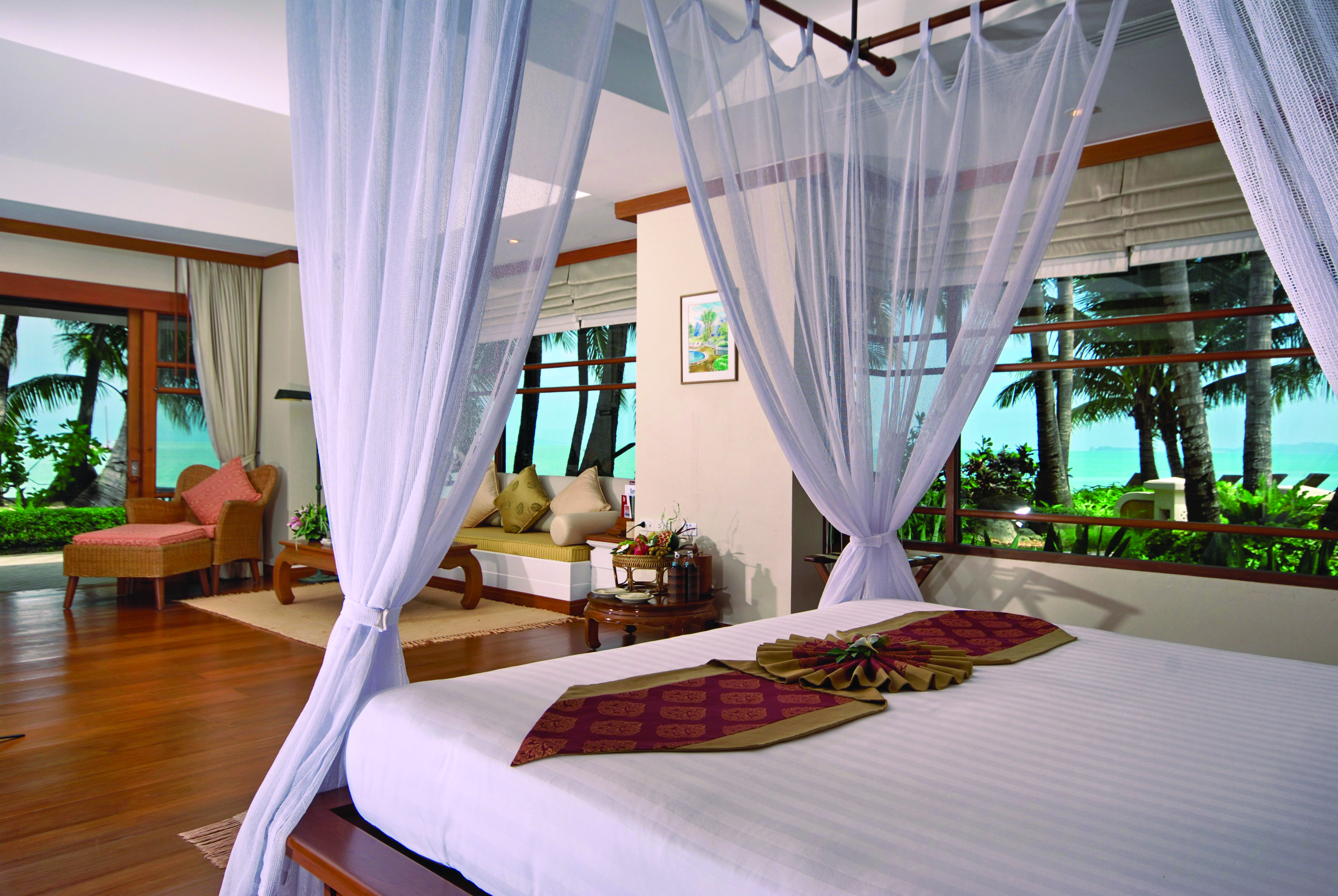 Santiburi Resort Thailand villa interior canopied bed lounge area modern décor